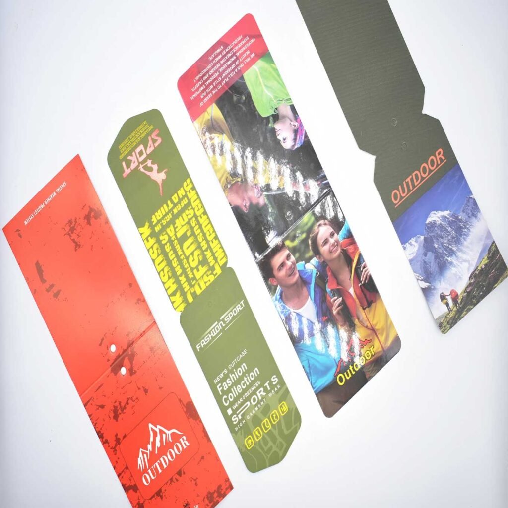 Heavy custom embossed clothing hang tags with string and eyelet for outdoor sports and fashion apparel collection.